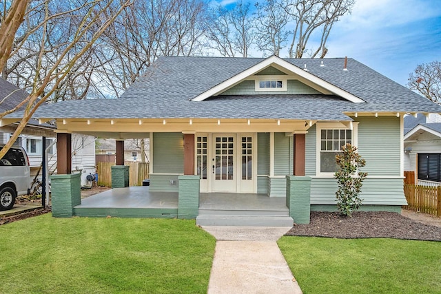 view of front of house featuring a front yard and covered porch