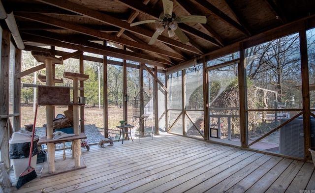 unfurnished sunroom featuring lofted ceiling, a wealth of natural light, and ceiling fan