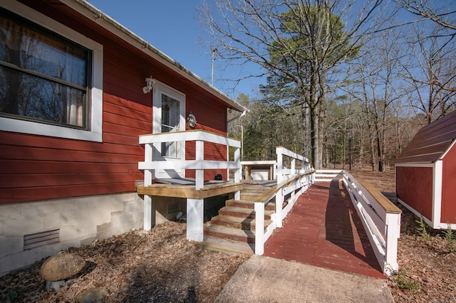 wooden terrace with a storage unit