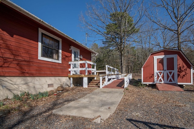 exterior space with a shed