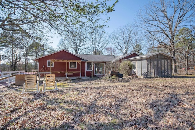 view of front of house with a sunroom