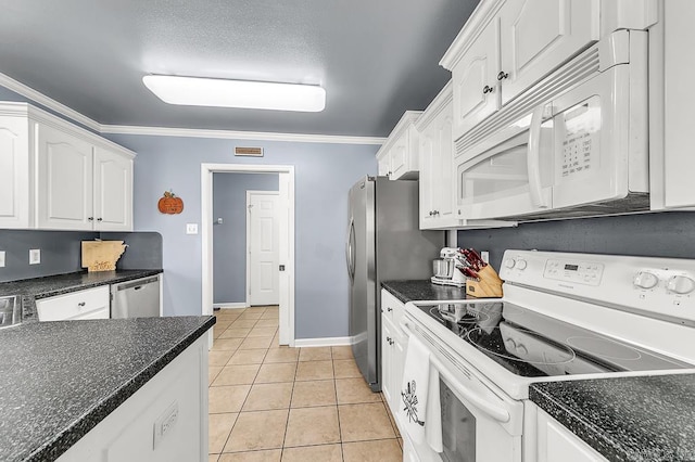 kitchen with white cabinetry, ornamental molding, stainless steel appliances, and light tile patterned flooring