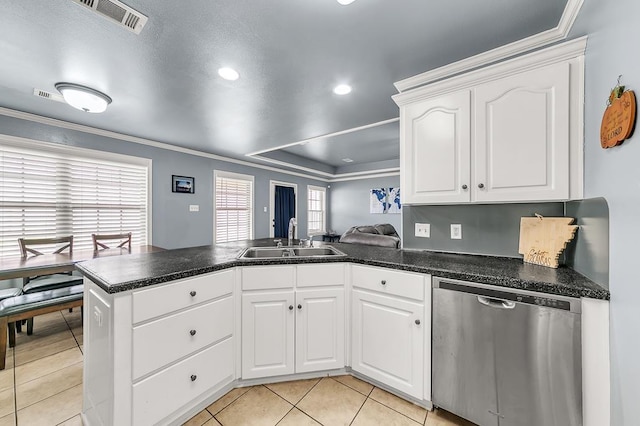 kitchen with white cabinetry, sink, ornamental molding, stainless steel dishwasher, and kitchen peninsula