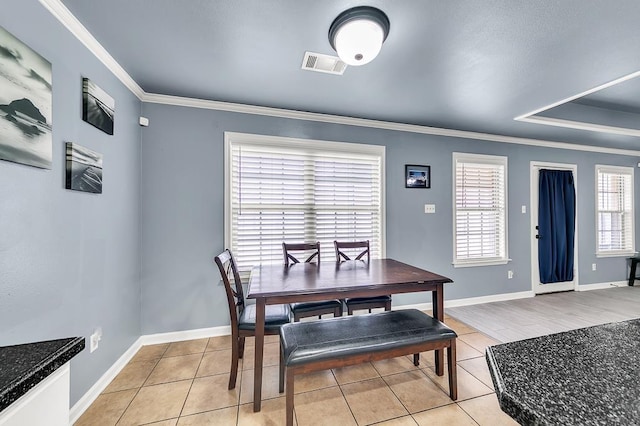 tiled dining area with crown molding