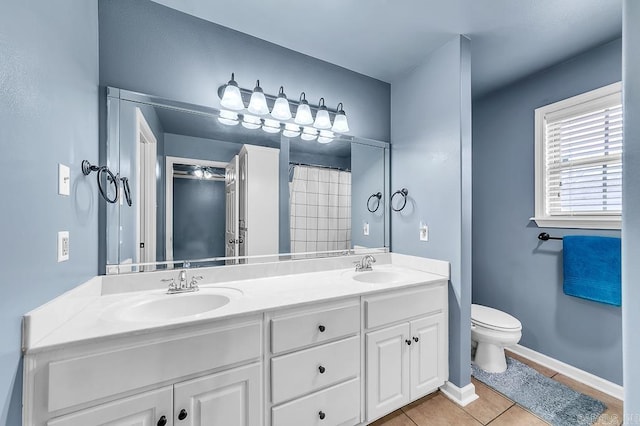 bathroom with a shower with curtain, vanity, toilet, and tile patterned flooring