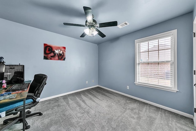 home office featuring ceiling fan and carpet