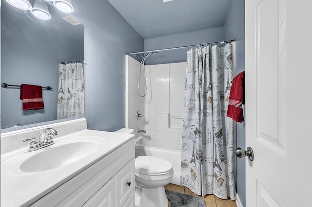 full bathroom with vanity, shower / tub combo, tile patterned floors, and toilet