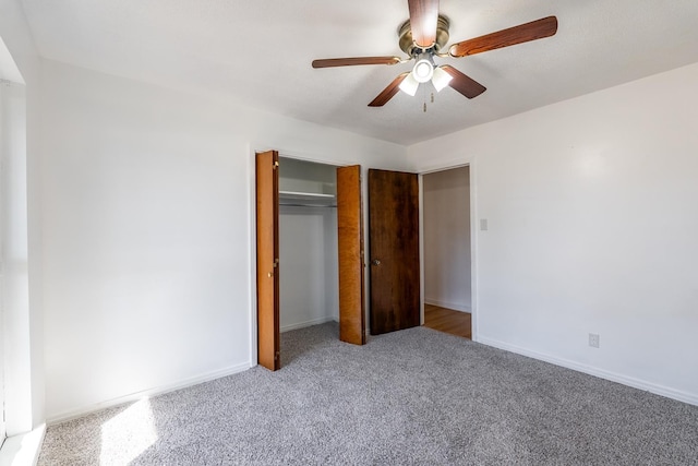 unfurnished bedroom with a closet, ceiling fan, and carpet