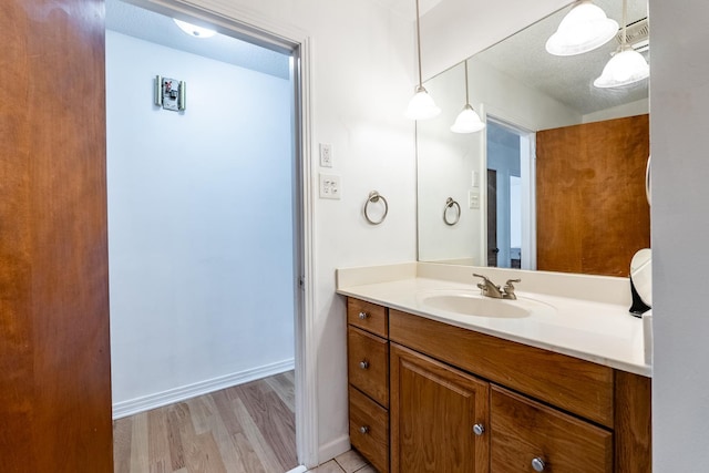 bathroom with vanity and wood-type flooring