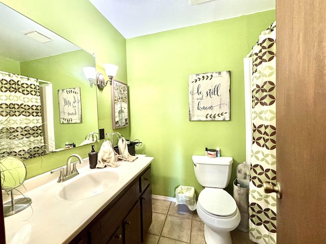 bathroom featuring vanity, toilet, and tile patterned flooring