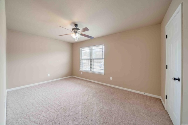 empty room with light carpet and ceiling fan