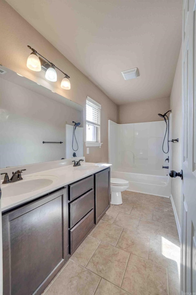 full bathroom featuring vanity, tile patterned floors, tub / shower combination, and toilet