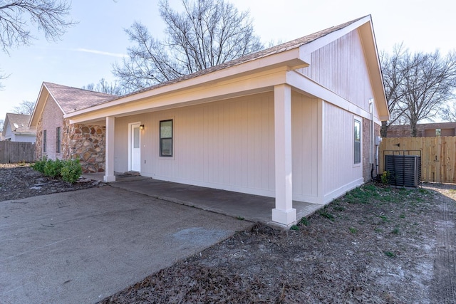 view of home's exterior featuring fence