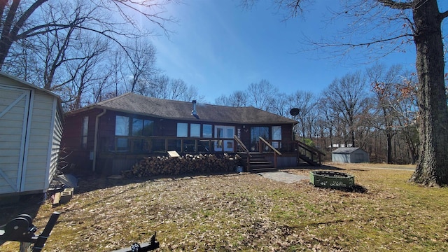 view of front of home featuring a front yard and a storage unit