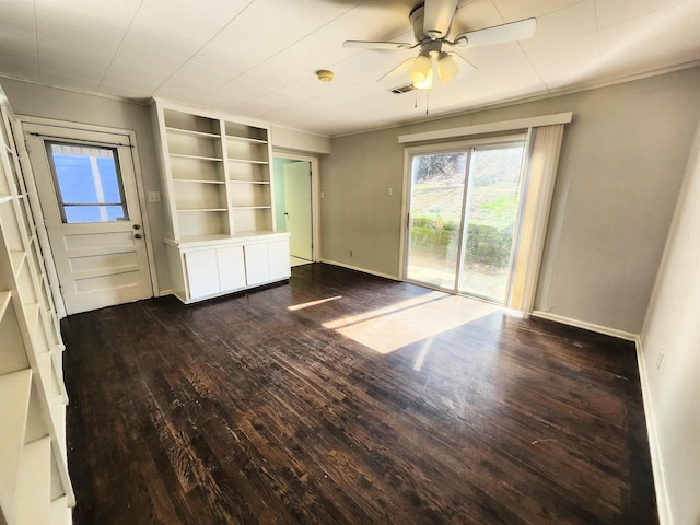 interior space with ceiling fan, access to outside, dark hardwood / wood-style floors, and crown molding