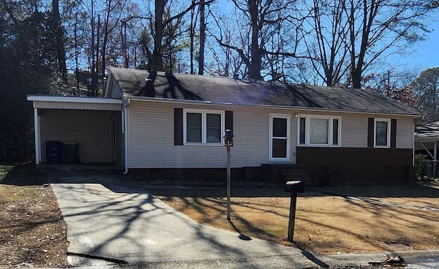 ranch-style house with a carport