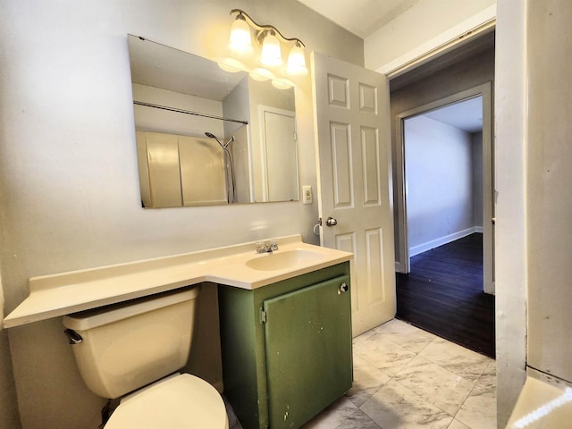 bathroom featuring toilet and vanity