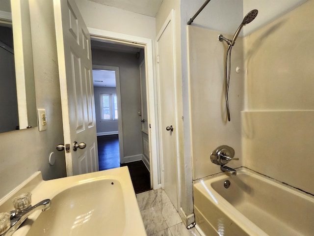 bathroom with sink and washtub / shower combination