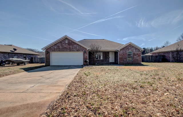 single story home featuring a front lawn and a garage