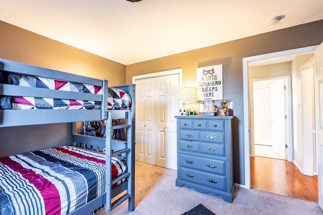 carpeted bedroom with a closet