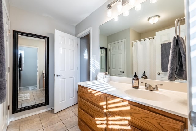 bathroom with tile patterned floors and vanity