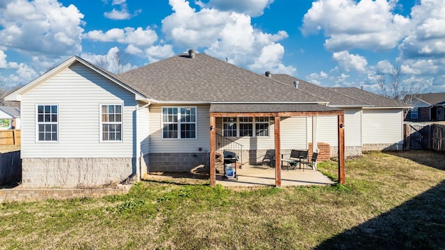 rear view of house featuring a yard and a patio