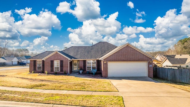 ranch-style house featuring a front lawn and a garage