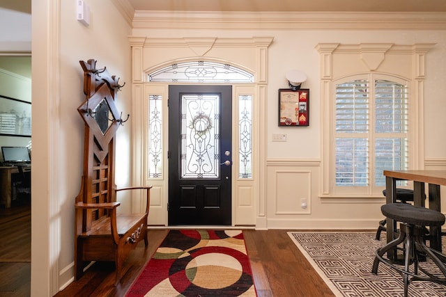 foyer featuring ornamental molding and dark wood-type flooring