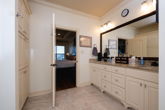 bathroom featuring ornamental molding and vanity