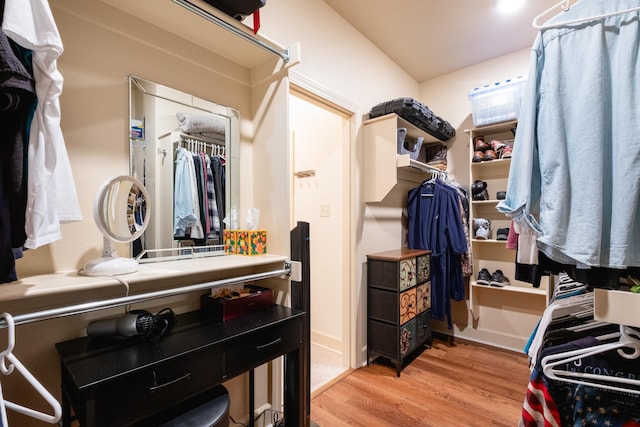 walk in closet featuring light hardwood / wood-style flooring