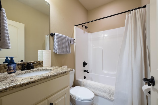 full bathroom featuring shower / tub combo with curtain, vanity, and toilet