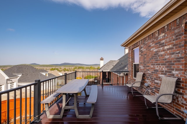 wooden deck featuring a mountain view