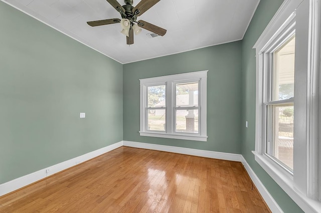 empty room with ceiling fan and light wood-type flooring