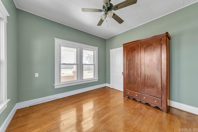 unfurnished bedroom with light hardwood / wood-style flooring and ceiling fan