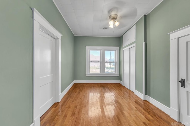 unfurnished room with light wood-type flooring