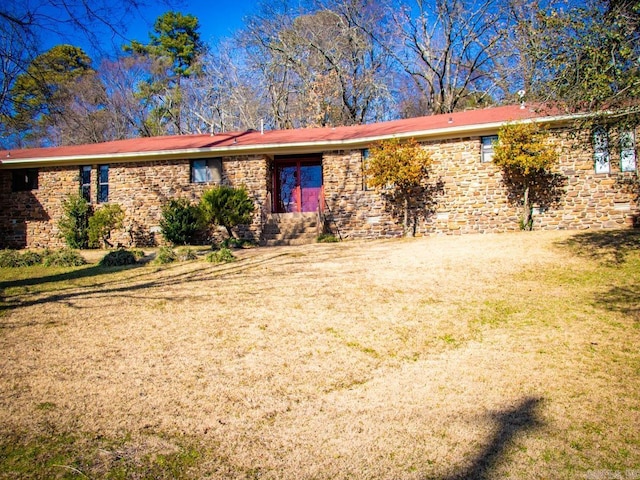 ranch-style home featuring a front yard