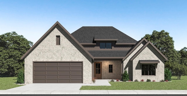 view of front facade with a front yard and a garage