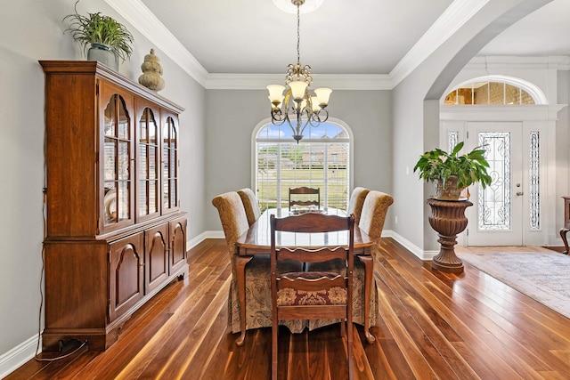 dining area with a notable chandelier, dark hardwood / wood-style floors, and a wealth of natural light