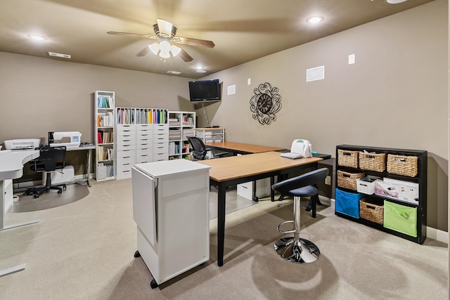 carpeted office with ceiling fan