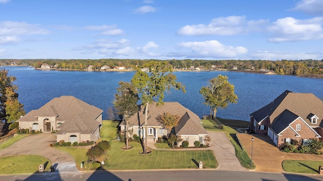 birds eye view of property with a water view