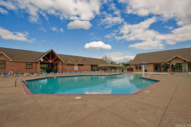 view of swimming pool featuring a patio