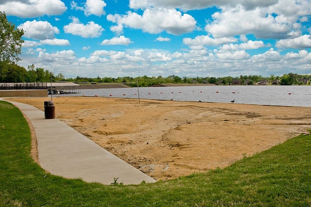 view of yard with a water view and volleyball court