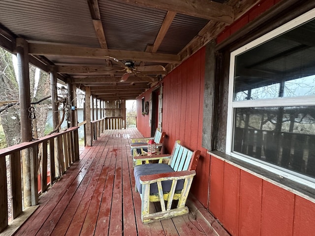 wooden terrace featuring ceiling fan