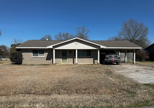 ranch-style house with a front lawn and a carport