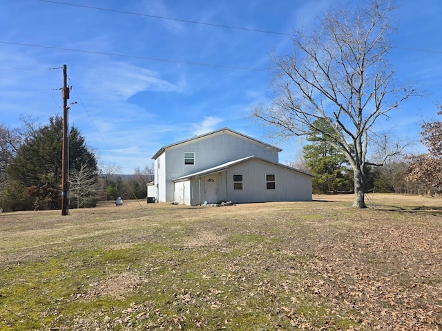 357 Polk Rd Unit 125, Mena, AR 71953 - exterior space featuring a lawn