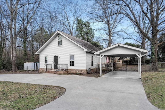 view of home's exterior with a lawn and a carport