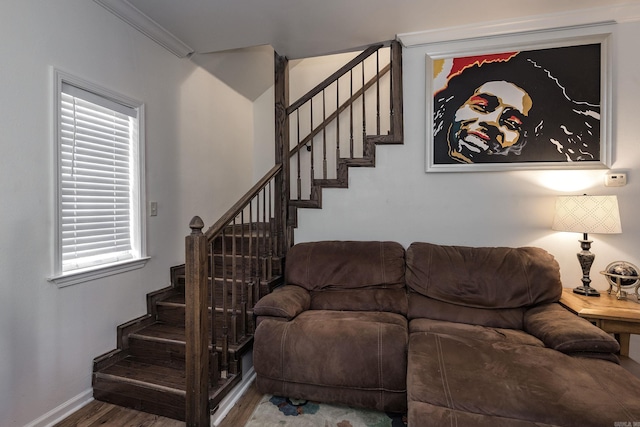 living room with hardwood / wood-style flooring and ornamental molding