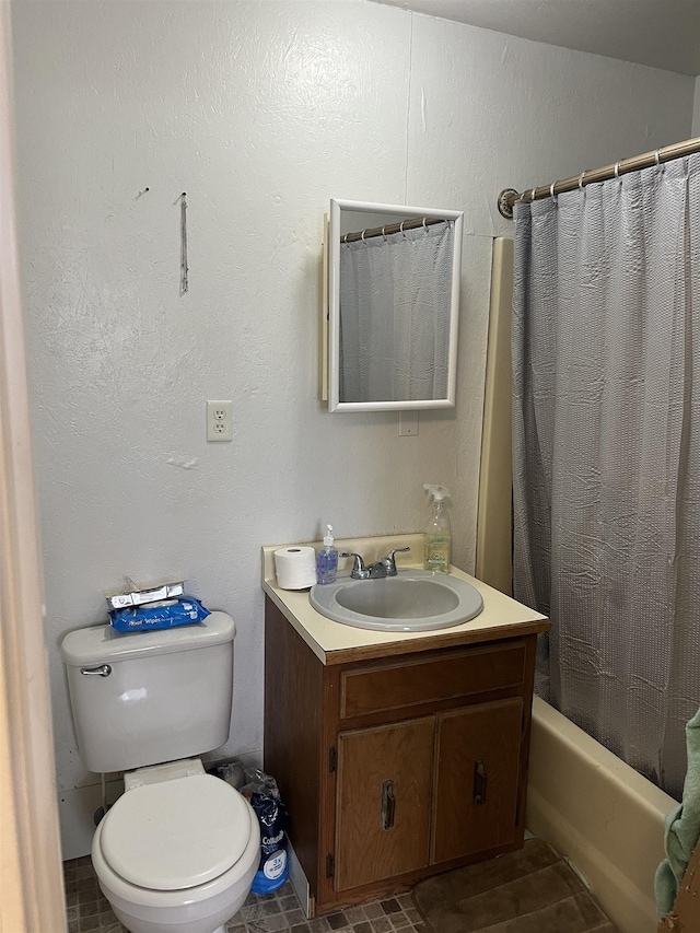 full bathroom with vanity, toilet, and shower / bath combo