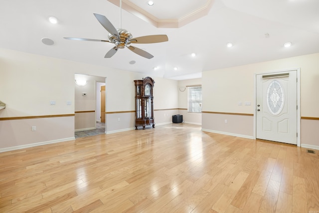 unfurnished living room featuring light wood-type flooring and ceiling fan