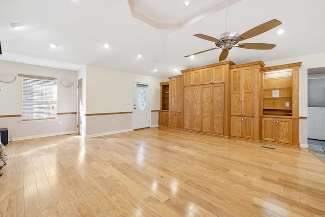 unfurnished living room featuring ornamental molding, ceiling fan, and light hardwood / wood-style floors